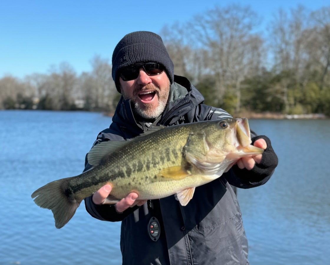 Jim Ivy holding up a prize winning fish